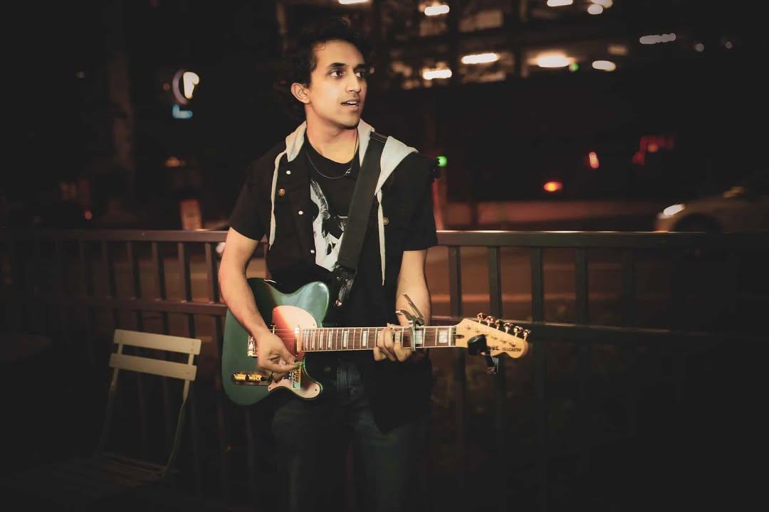 Image of Ankit playing his electric guitar